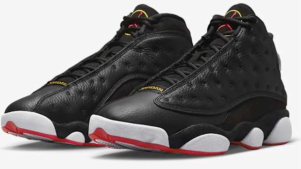 View of black, white, and red Air Jordan shoes.